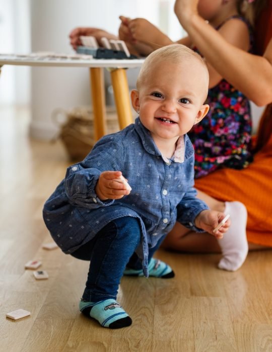 Happy child kids group have fun and play at kindergarden