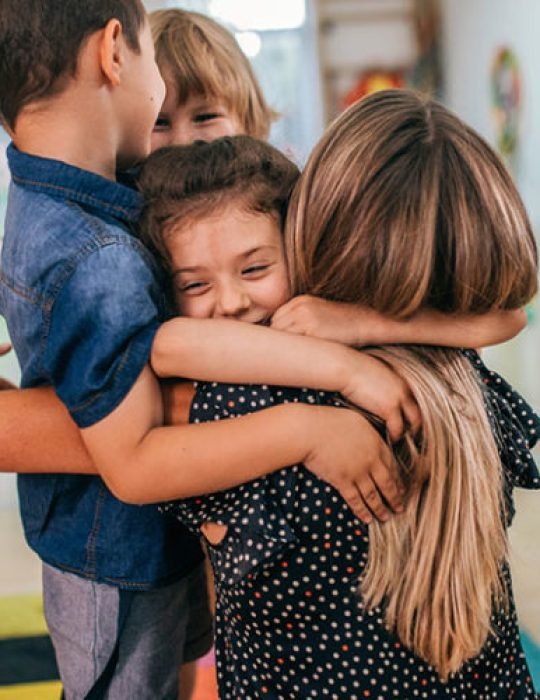 A group of preschool kids are playing indoors at daycare center